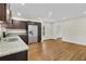 Modern kitchen with dark cabinets, granite counters, and stainless steel appliances at 4950 Nova Ave, St Cloud, FL 34773