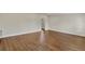 Spacious living area with wood-look floors and neutral walls at 4950 Nova Ave, St Cloud, FL 34773