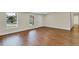 Open living area with wood-look floors and access to exterior at 4950 Nova Ave, St Cloud, FL 34773