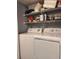 Stackable washer and dryer with shelving for storage at 5267 Images Cir # 303, Kissimmee, FL 34746