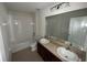 Bathroom boasts double vanity and bathtub at 640 Spanish Pine Rd, Davenport, FL 33837