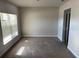 Bright bedroom with large window and neutral carpeting at 640 Spanish Pine Rd, Davenport, FL 33837