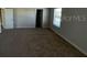 Primary bedroom with large window and neutral carpet at 640 Spanish Pine Rd, Davenport, FL 33837