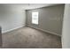 Simple bedroom with neutral carpeting and a window at 640 Spanish Pine Rd, Davenport, FL 33837