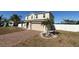 Two-story house with a brick driveway and a landscaped lawn at 640 Spanish Pine Rd, Davenport, FL 33837