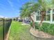 Neat backyard with palm trees and gravel landscaping at 681 San Joaquin Rd, Poinciana, FL 34759