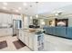 Eat-in kitchen with island, stainless steel appliances, and views to the Gathering room at 681 San Joaquin Rd, Poinciana, FL 34759