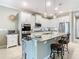 Spacious kitchen with granite countertops, stainless steel appliances, and an island at 681 San Joaquin Rd, Poinciana, FL 34759