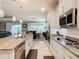 Modern kitchen with stainless steel appliances and an open layout to the dining area at 681 San Joaquin Rd, Poinciana, FL 34759