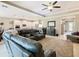 Open living area with leather sectional sofa and large TV at 681 San Joaquin Rd, Poinciana, FL 34759