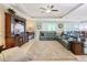 Large living room with sectional and built-in entertainment center at 681 San Joaquin Rd, Poinciana, FL 34759
