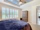 Main bedroom with king-size bed and ample closet space at 681 San Joaquin Rd, Poinciana, FL 34759