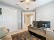 Home office features a desk, couch, and built-in shelving at 681 San Joaquin Rd, Poinciana, FL 34759