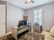 Home office with a desk, couch, and built-in shelving at 681 San Joaquin Rd, Poinciana, FL 34759