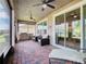 Relaxing screened patio with brick pavers and outdoor seating at 681 San Joaquin Rd, Poinciana, FL 34759
