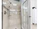 Large walk-in shower with tiled walls and glass door at 681 San Joaquin Rd, Poinciana, FL 34759