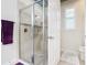 Walk-in shower with tiled walls and built-in seat at 681 San Joaquin Rd, Poinciana, FL 34759