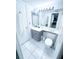Clean bathroom with a vanity, toilet, and large mirror at 72 Aspen Dr, Haines City, FL 33844