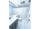 Clean bathroom with white tile and a shower/tub combo at 72 Aspen Dr, Haines City, FL 33844