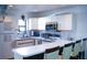 White kitchen with stainless steel appliances and an eat-in counter at 72 Aspen Dr, Haines City, FL 33844