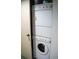Compact laundry closet with stackable washer and dryer at 72 Aspen Dr, Haines City, FL 33844