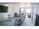 Living room with view of patio, featuring comfy seating at 72 Aspen Dr, Haines City, FL 33844