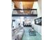Spacious living room with high ceilings, a loft, and a comfy sofa at 72 Aspen Dr, Haines City, FL 33844