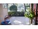 Small patio with tiled floor and trampoline at 72 Aspen Dr, Haines City, FL 33844