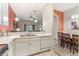 Kitchen with white cabinets, and a view into dining area at 911 New Providence # 911, Davenport, FL 33897