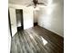 Spacious bedroom with wood-look floors and walk-in closet at 916 S Park Ct, Kissimmee, FL 34741
