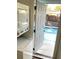 Laundry room with access to the backyard pool at 916 S Park Ct, Kissimmee, FL 34741