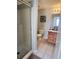 Clean bathroom with shower and wood cabinets at 922 Sandy Ridge Drive Dr, Davenport, FL 33896