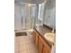 Clean bathroom with shower/tub combo and wood cabinets at 922 Sandy Ridge Drive Dr, Davenport, FL 33896