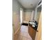 Clean bathroom with tub, shower, vanity, and door to outdoors at 922 Sandy Ridge Drive Dr, Davenport, FL 33896