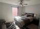 Bedroom with full-size bed, window and new carpet at 922 Sandy Ridge Drive Dr, Davenport, FL 33896