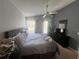 King bedroom with TV and plenty of natural light at 922 Sandy Ridge Drive Dr, Davenport, FL 33896