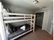 Bedroom featuring a bunk bed, closet, and neutral decor at 922 Sandy Ridge Drive Dr, Davenport, FL 33896