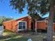 Charming single story home with a terracotta exterior at 922 Sandy Ridge Drive Dr, Davenport, FL 33896