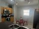 Kitchen features stainless steel appliances and wood cabinets at 922 Sandy Ridge Drive Dr, Davenport, FL 33896