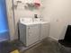 Convenient laundry room with washer, dryer, and shelving at 922 Sandy Ridge Drive Dr, Davenport, FL 33896