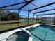 Screened pool and spa with pond view at 922 Sandy Ridge Drive Dr, Davenport, FL 33896