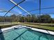 Inviting screened pool and spa with tranquil water features at 922 Sandy Ridge Drive Dr, Davenport, FL 33896