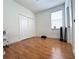 Bright bedroom with wood floors and double door closet at 10786 Savannah Wood Dr # 126, Orlando, FL 32832