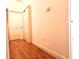 Light hallway with wood flooring and linen closet at 10786 Savannah Wood Dr # 126, Orlando, FL 32832