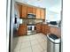 Well-equipped kitchen with stainless steel appliances at 10786 Savannah Wood Dr, Orlando, FL 32832