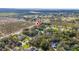Aerial view showing home location in a quiet, secluded neighborhood with mature trees and lush landscaping at 2828 Sequoyah Dr, Haines City, FL 33844
