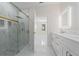 Modern bathroom with a walk-in shower and double vanity at 2828 Sequoyah Dr, Haines City, FL 33844