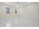 Spacious bedroom with two windows and tile flooring at 2828 Sequoyah Dr, Haines City, FL 33844