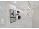 Modern kitchen with white cabinets, stainless steel appliances, and a large island at 2828 Sequoyah Dr, Haines City, FL 33844