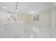 Modern kitchen with white cabinets, stainless steel appliances, and a large island at 2828 Sequoyah Dr, Haines City, FL 33844